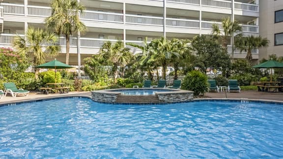 Near Beach~Lush View~Heated Pool~Balcony - Image 1